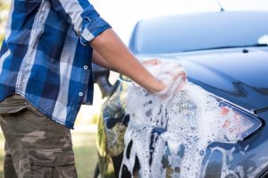 Grown-up washing car